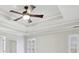 Close up of ceiling fan with tray ceilings and neutral walls at 1884 Point River Dr, Duluth, GA 30097