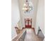 A view from the second story balcony shows the foyer, with a chandelier and wood floors at 1884 Point River Dr, Duluth, GA 30097