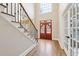 Grand foyer showcasing hardwood floors, staircase, a window, and double front doors at 1884 Point River Dr, Duluth, GA 30097