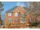 Charming brick two-story home with well-maintained landscaping and a welcoming entrance at 1884 Point River Dr, Duluth, GA 30097