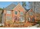 Charming brick two-story home with well-maintained landscaping and a welcoming entrance at 1884 Point River Dr, Duluth, GA 30097