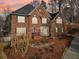 Charming two-story brick home with a landscaped front yard and a well-manicured lawn at 1884 Point River Dr, Duluth, GA 30097