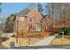Charming two-story brick home with a well manicured front yard landscape at 1884 Point River Dr, Duluth, GA 30097