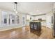 Modern kitchen featuring white cabinets, stainless steel appliances, and a functional center island at 1884 Point River Dr, Duluth, GA 30097