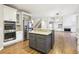 Open-concept kitchen with granite countertops, stainless steel appliances, and center island with seating at 1884 Point River Dr, Duluth, GA 30097