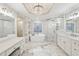 Bright main bathroom featuring a soaking tub, glass shower, and dual vanity at 1884 Point River Dr, Duluth, GA 30097