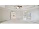 Spacious main bedroom with large windows, tray ceilings, and neutral carpet at 1884 Point River Dr, Duluth, GA 30097