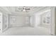 Spacious main bedroom with large windows, tray ceilings, and neutral carpet at 1884 Point River Dr, Duluth, GA 30097