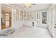 Sunroom with tiled flooring, built in cabinets, and multiple windows with backyard views at 1884 Point River Dr, Duluth, GA 30097