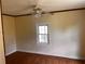 Bedroom with ceiling fan and trim at 3310 Pilgrim Mill Rd, Cumming, GA 30041
