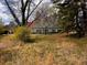 Exterior view of home on large lot with mature trees and lawn at 3310 Pilgrim Mill Rd, Cumming, GA 30041