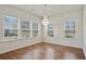 Bright dining room featuring a modern chandelier and large windows offering plenty of natural light at 3891 Shelleydale Dr, Powder Springs, GA 30127