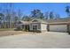 Charming single-story home with a brick-accented garage and a well-manicured front yard at 3891 Shelleydale Dr, Powder Springs, GA 30127
