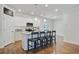 Stylish kitchen with a granite island, white cabinets, stainless steel appliances, and bar stool seating at 3891 Shelleydale Dr, Powder Springs, GA 30127