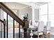 View of dining room from stairs; includes hardwood floors, designer furniture and decor, and natural light at 600 Belshire Dr, Acworth, GA 30102