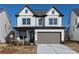 Charming two-story home with a neutral palette, inviting curb appeal, and a well-manicured front yard at 600 Belshire Dr, Acworth, GA 30102