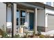 Inviting front porch with rocking chairs, stylish decor, and charming brick accents at 600 Belshire Dr, Acworth, GA 30102