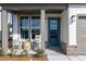 Inviting front porch with rocking chairs, stylish decor, and charming brick accents at 600 Belshire Dr, Acworth, GA 30102