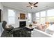 Cozy living room features a fireplace and lots of natural light at 600 Belshire Dr, Acworth, GA 30102