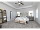 Spacious primary bedroom features tray ceiling and two night stands and large bed at 600 Belshire Dr, Acworth, GA 30102