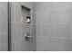 Tiled shower with showerhead and shampoo niche at 600 Belshire Dr, Acworth, GA 30102