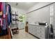 Well-organized closet with shelves, drawers, laundry, and ample storage at 1116 Citadel Dr, Atlanta, GA 30324