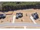 Aerial shot of a well-kept home with nice landscaping and a long, curved driveway, surrounded by a green lawn at 112 Standford Dr, Mcdonough, GA 30252