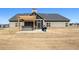 Expansive backyard with a patio area featuring a hot tub, grill, and ample green space at 112 Standford Dr, Mcdonough, GA 30252