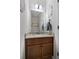 Half-bath features granite countertop, framed mirror, and modern sink faucet at 112 Standford Dr, Mcdonough, GA 30252