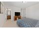 Bedroom with ensuite bathroom, television and neutral color palette at 112 Standford Dr, Mcdonough, GA 30252