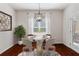 Charming dining room with modern light fixture, stylish decor, and hardwood floors at 112 Standford Dr, Mcdonough, GA 30252