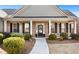 Inviting front porch with classic columns and well-maintained landscaping at 112 Standford Dr, Mcdonough, GA 30252