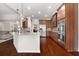 Modern kitchen with granite countertops, stainless steel appliances, pendant lighting, and ample cabinet space at 112 Standford Dr, Mcdonough, GA 30252