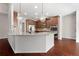 Modern kitchen with granite countertops, stainless steel appliances, pendant lighting, and ample cabinet space at 112 Standford Dr, Mcdonough, GA 30252
