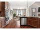 Modern kitchen featuring stainless steel appliances, granite countertops, and hardwood floors at 112 Standford Dr, Mcdonough, GA 30252