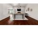 Bright living room featuring hardwood floors, a fireplace, high ceilings and comfortable furniture at 112 Standford Dr, Mcdonough, GA 30252