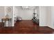 Open living space featuring hardwood floors, a side table, an exercise machine, and plenty of natural light at 112 Standford Dr, Mcdonough, GA 30252