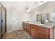 Main bathroom featuring a double sink vanity, granite countertops, and walk-in shower at 112 Standford Dr, Mcdonough, GA 30252