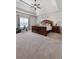 Spacious main bedroom featuring a tray ceiling, ceiling fan, and decorative wall sign at 112 Standford Dr, Mcdonough, GA 30252