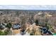A beautiful view of a neighborhood with lush tree coverage, upscale homes, and well-manicured lawns at 7455 Richmond Way, Cumming, GA 30040