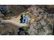 Aerial view of a home with mature trees and a driveway outlined, in a lovely neighborhood at 7455 Richmond Way, Cumming, GA 30040