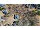 Aerial view of the house nestled among mature trees offering privacy in a peaceful setting at 7455 Richmond Way, Cumming, GA 30040