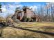 Spacious backyard with mature trees, lush landscaping, and a deck that is perfect for outdoor entertaining at 7455 Richmond Way, Cumming, GA 30040