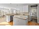 Kitchen with an island, granite countertops, stainless steel appliances, and a view to the dining area at 7455 Richmond Way, Cumming, GA 30040