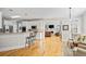 Open floor plan showcasing the kitchen, bar seating, and living room area at 7455 Richmond Way, Cumming, GA 30040