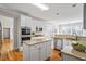 Well-equipped kitchen featuring granite countertops, stainless steel appliances, an island, and ample cabinetry at 7455 Richmond Way, Cumming, GA 30040