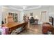 Spacious home office featuring a large wooden desk and bookshelves at 7455 Richmond Way, Cumming, GA 30040