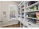 Pantry with built in shelving and natural light at 7455 Richmond Way, Cumming, GA 30040