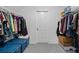 Functional walk-in closet providing ample storage with organized shelving, hanging space, and storage bins at 7455 Richmond Way, Cumming, GA 30040
