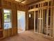 A framed room shows wood studs, a window opening, and door openings, pre-construction at 001 White St # 1, Marietta, GA 30060